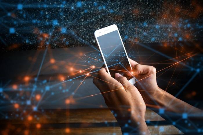 Person using a mobile phone AdobeStock 206610388